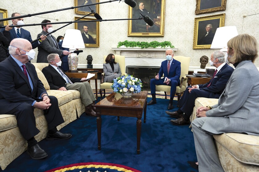 President Joe Biden and Vice President Kamala Harris discuss a COVID-19 releif bill with Senators at the White House in February.