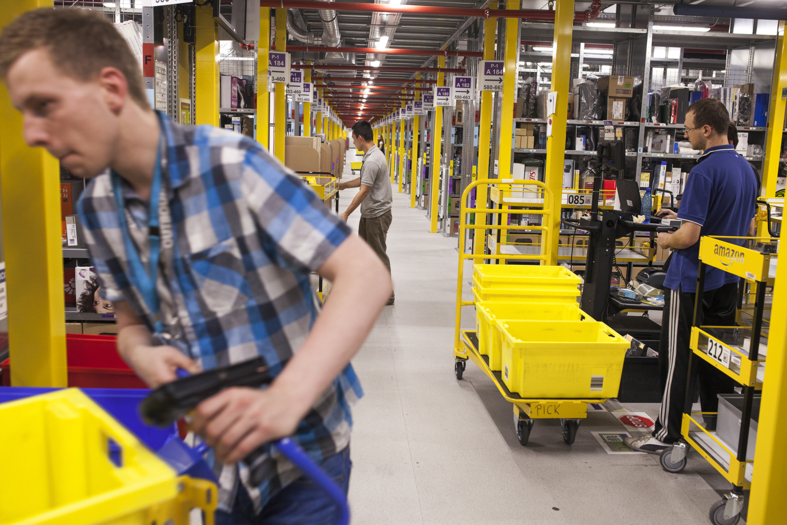 Amazon warehouse workers lose bonuses, stock awards for ...