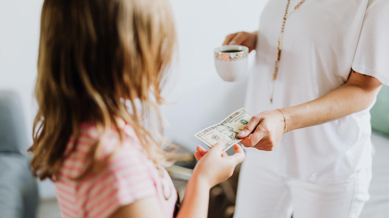 Parent and child with money
