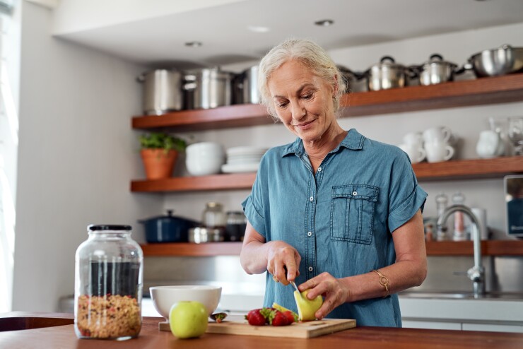 Woman cutting fruit