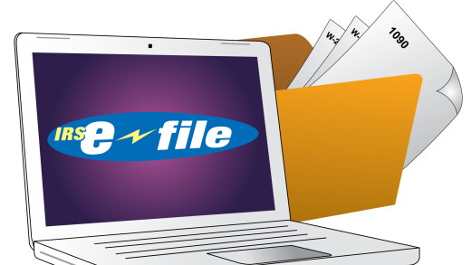 IRS e-file on laptop screen in front of tax forms in folder