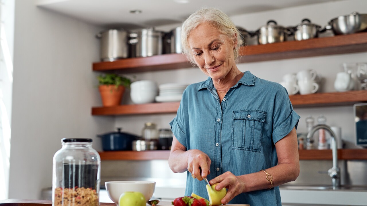 Woman cutting fruit