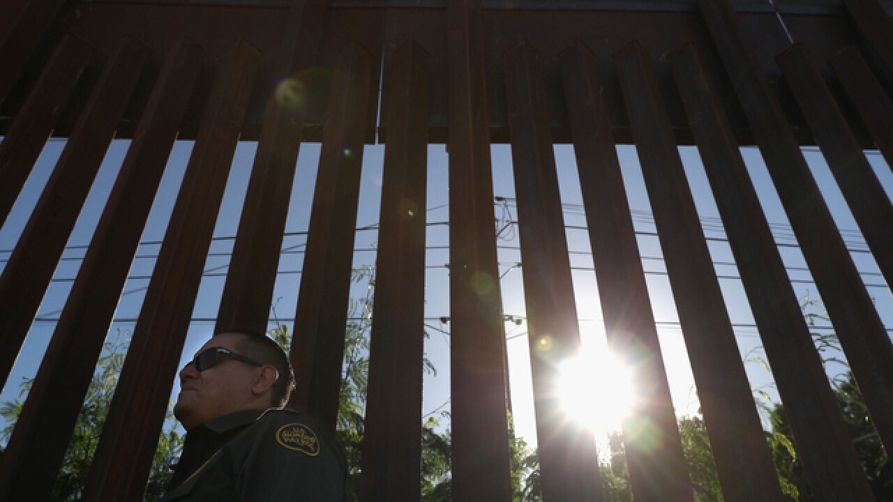 Border fence with guard