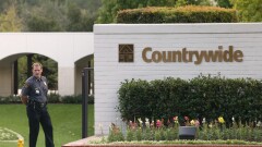 A security guard stands outside the Countrywide Financial Corp. headquarters in Calabasas, California on Wednesday, October 20, 2004.