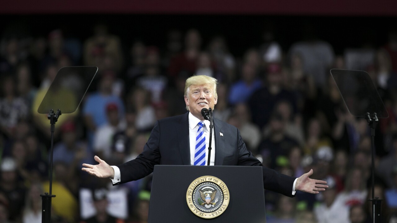 U.S. President Donald Trump gestures while speaking during a rally.