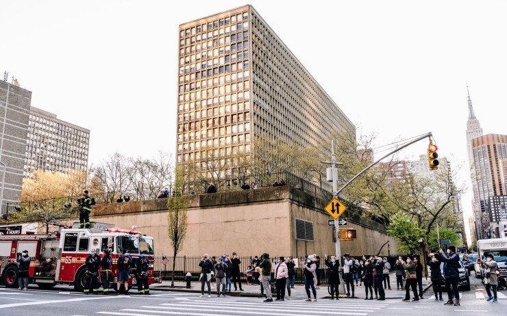 Members of the New York Fire Department gather outside New York University Langone Health hospital in Manhattan to applaud the medical staff and essential workers during the pandemic in 2020.