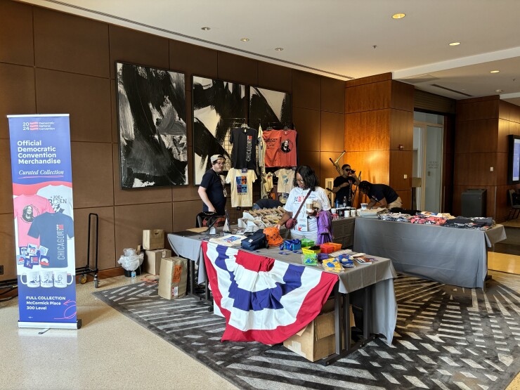 DNC attendees browse merchandise being sold at the 2024 Democratic National Convention