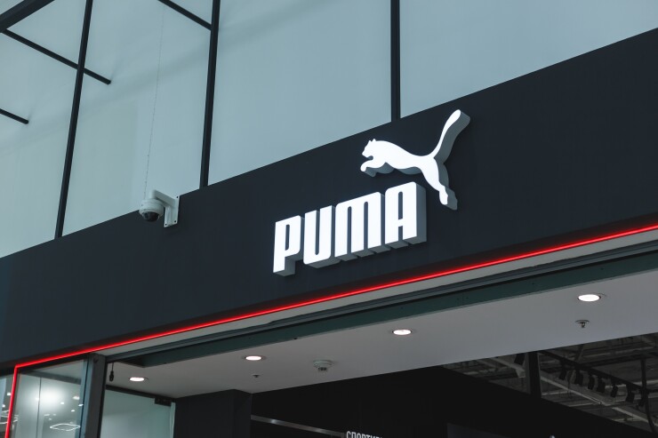 Puma storefront, with the logo on the front, which features the name and the puma animal leaping over the name.