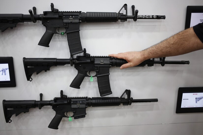 AR-15 rifles are displayed on the exhibit floor during the National Rifle Association (NRA) annual meeting in Louisville, Kentucky, U.S., on Friday, May 20, 2016. 