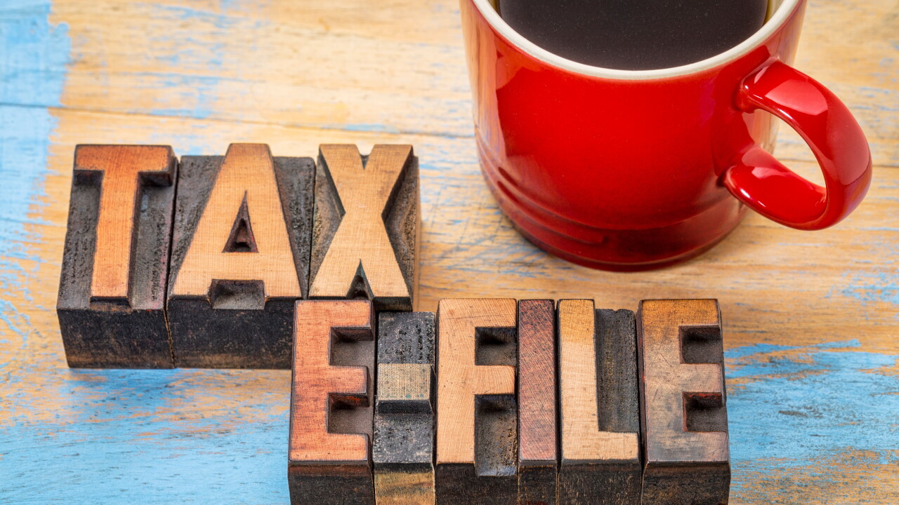 tax electronic filing concept - word abstract in vintage letterpress wood type with a cup of coffee