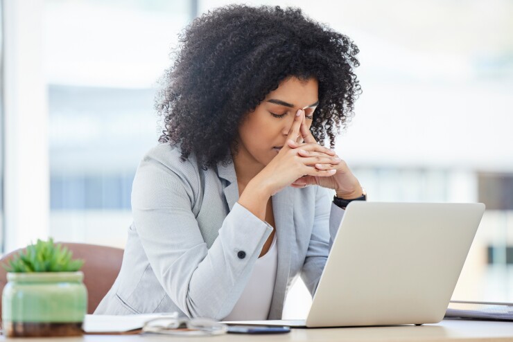 Stressed out employee at desk