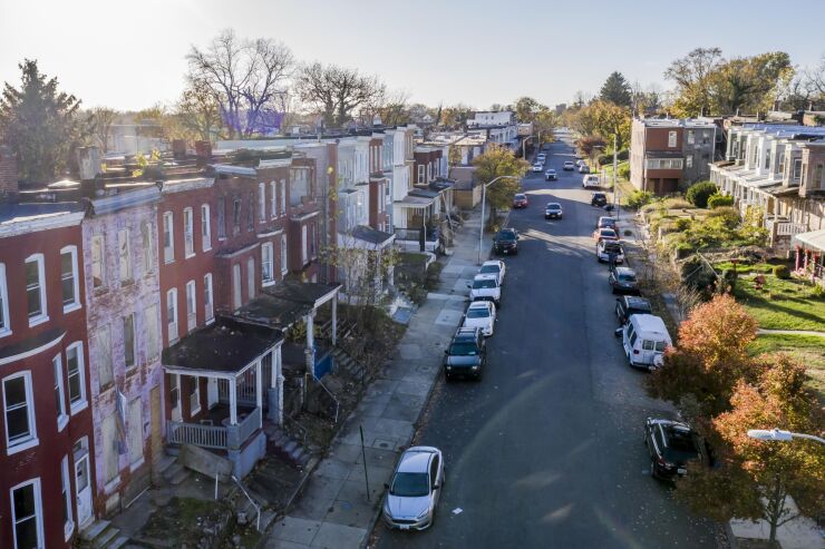 Homes in West Baltimore, Maryland, some of which are abandoned and boarded up.