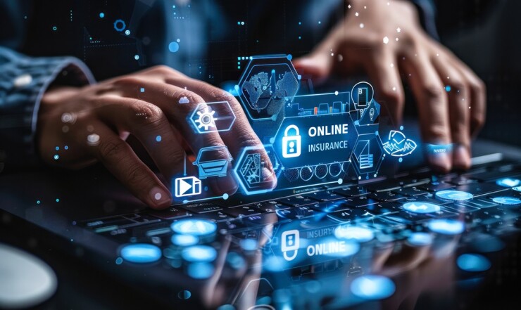 Man's hands typing behind a diagram that says online insurance