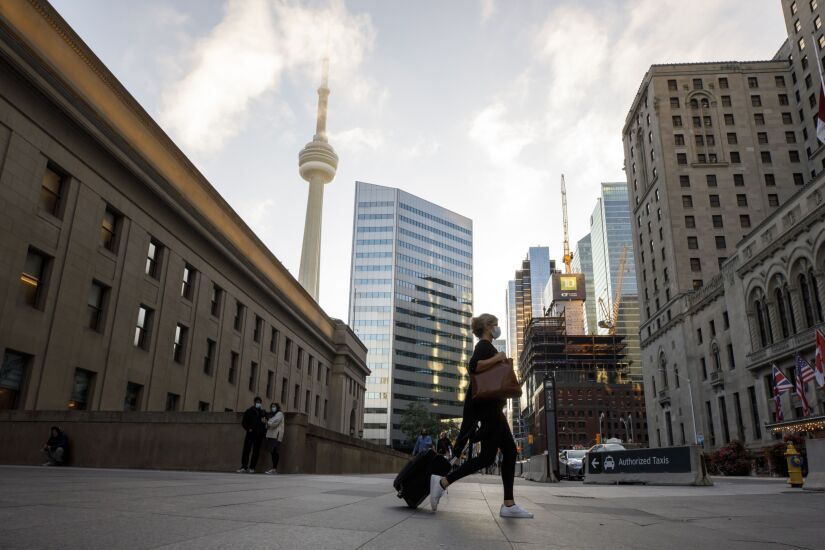 A traveler exits Union Station in Toronto, Ontario, Canada, on Wednesday, Oct. 6, 2021. Prime Minister Trudeau announced new rules Wednesday requiring passengers age 12 or older on planes, trains and cruise ships within the country to be fully vaccinated as of Oct. 30. Photographer: Cole Burston/Bloomberg