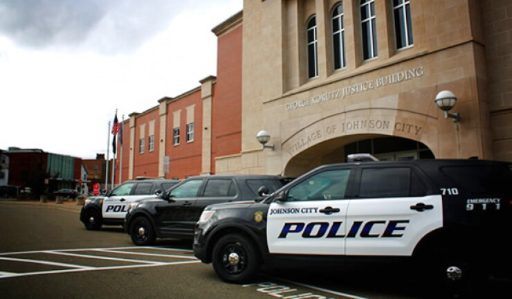 Police cars and justice building in Johnson City, New York