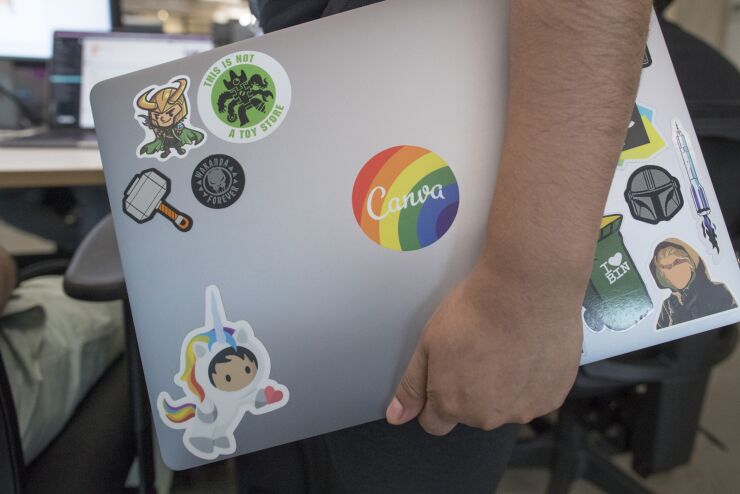 Branding on a laptop computer at the Canva Inc. headquarters in Sydney, Australia, on Wednesday, Sept. 14, 2022. Australian design software company Canva's platform has gained popularity among smaller companies and Gen Zs since its inception in 2013. Photographer: Brent Lewin/Bloomberg