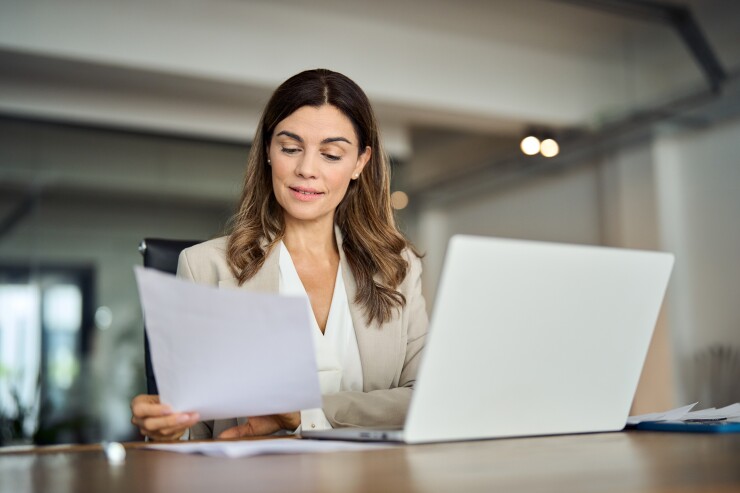 Employee reading paper