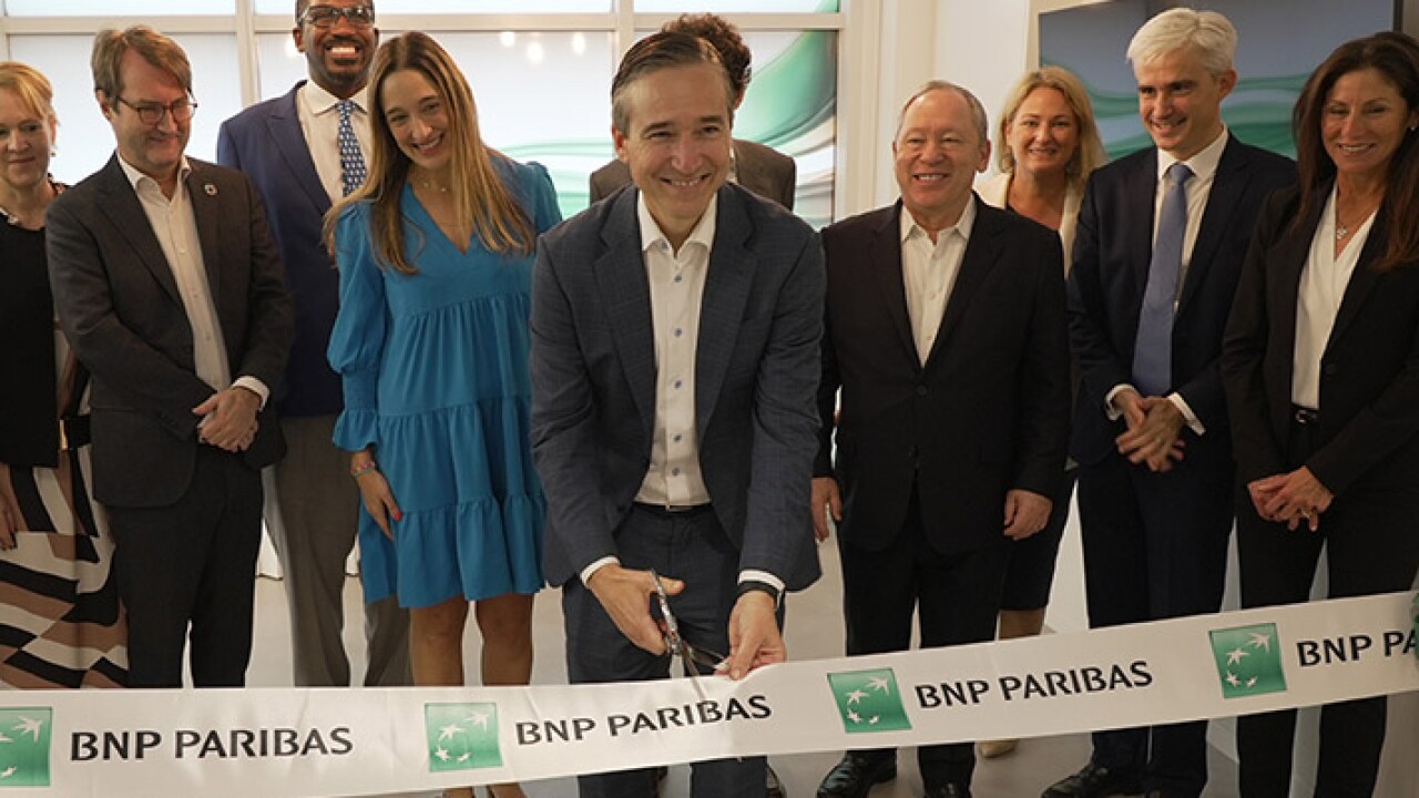BNP Paribas executives including (middle L-R) Annabella Espina, Miami office COO, Matt O’Connor, head of the new Miami office, Olivier Osty, head of global markets, José Placido, U.S. CEO along with BNP and local elected officials and leaders including Laura DiBella of FloridaCommerce, Raphaël Trapp, Consul General of France in Miami, and Rodrick Miller of the Miami-Dade Beacon Council, cut a ribbon on Wednesday to officially open the bank’s offices in the Brickell Ave area of Miami.