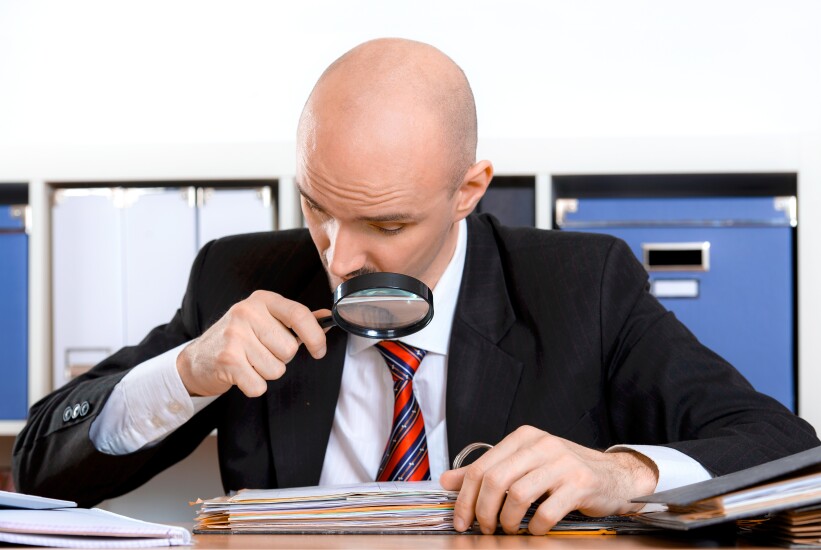 Man with magnifying glass