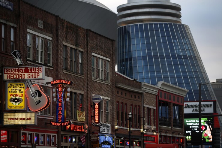 Neon signs and the Bridgestone Arena are pictured on Broadway in downtown Nashville, Tenn., U.S. on Saturday, Feb. 8, 2014.