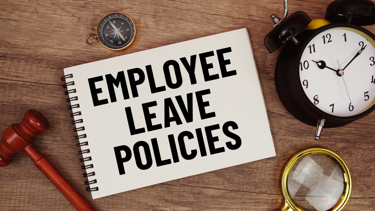 Employee leave policies notebook with legislation and time references