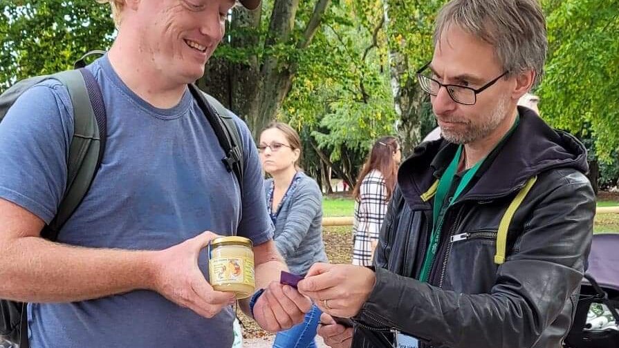 Bee farmer Anton Lundqvist (right) and customer