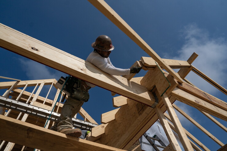 Worker building house in Lillington, North Carolina, in 2023