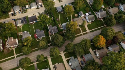 Aerial drone view of American suburban neighborhood at daytime.