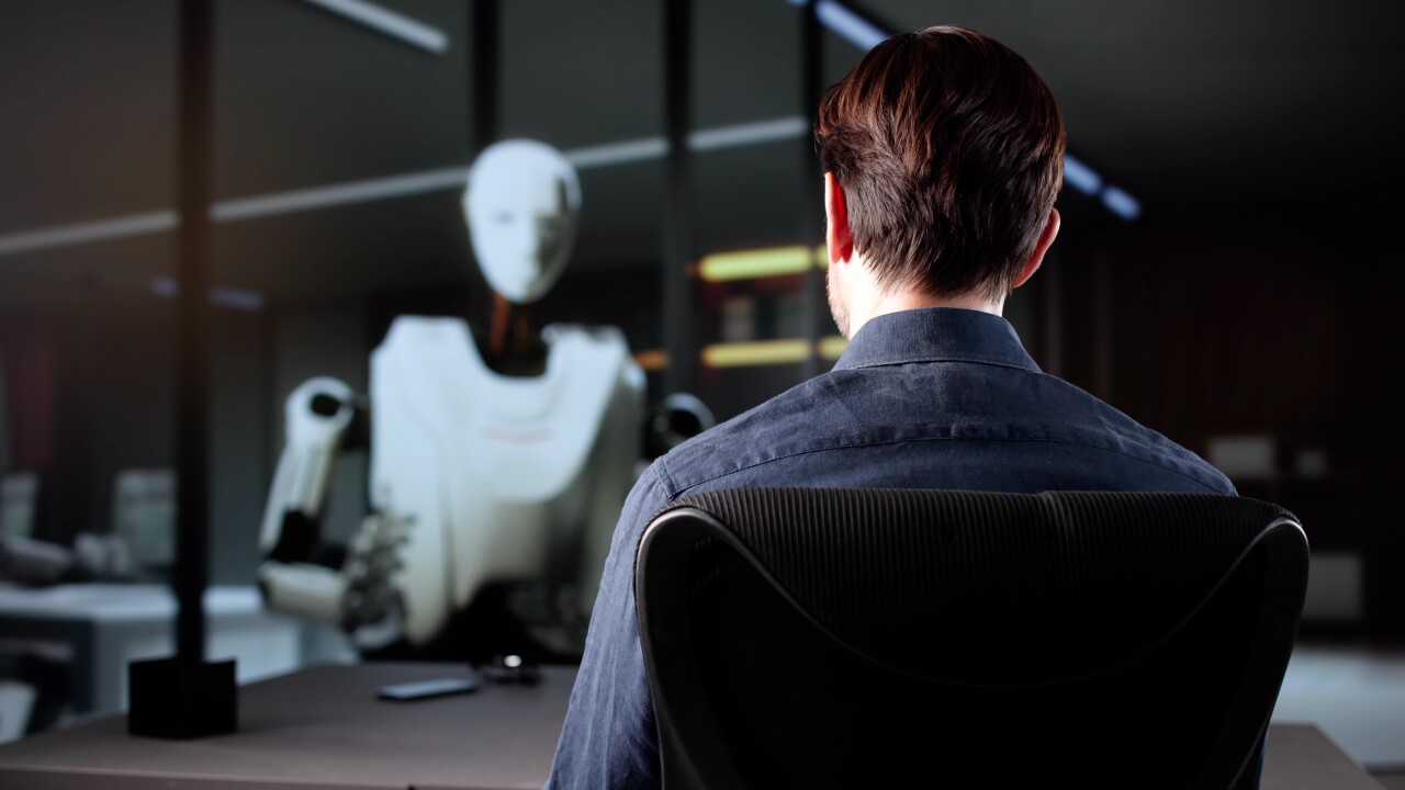 Job candidate being interviewed by a robot