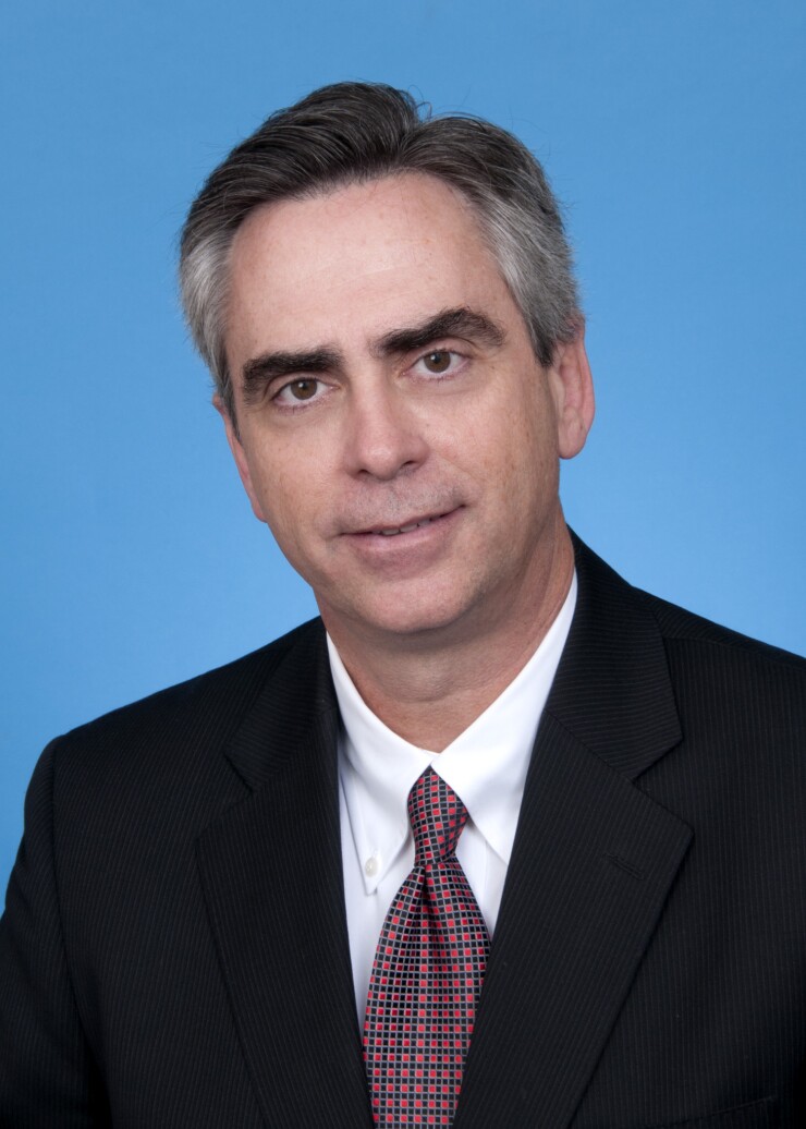 Doug Samuels, CEO of Space Coast CU, who passed away at age 57