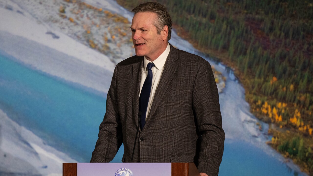 Alaska Gov. Mike Dunleavy at podium