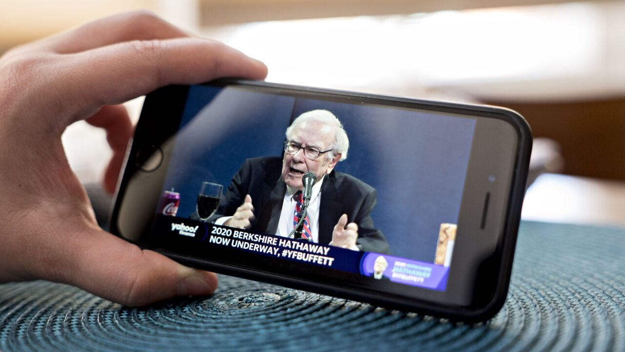 Warren Buffett, chairman and CEO of Berkshire Hathaway, speaks during the company's virtual annual shareholders meeting seen on a smartphone on May 2, 2020.