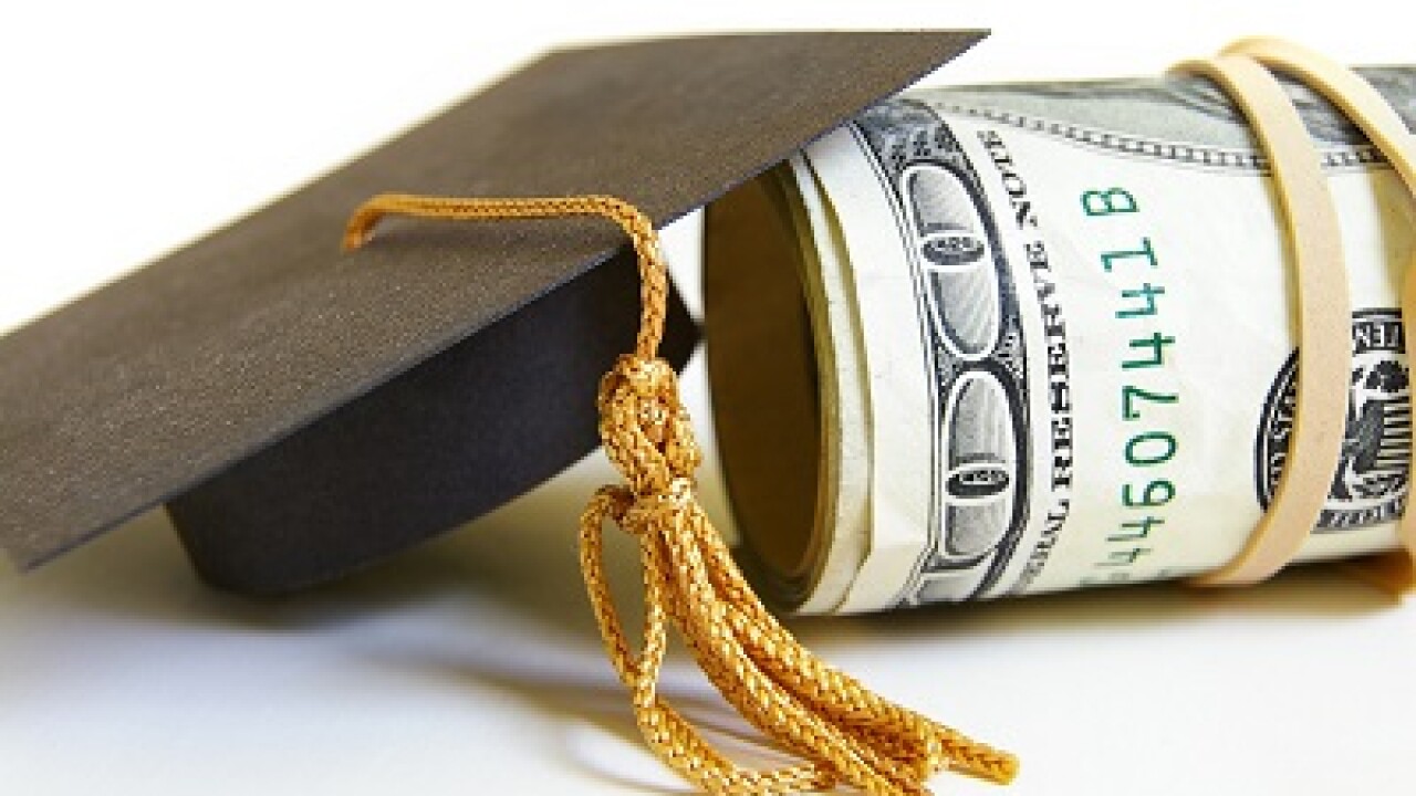 graduation cap and cash roll, closeup