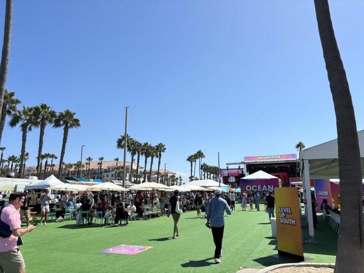 Financial advisors and wealth management executives spoke on five different stages and visited tent kiosks purchased on the site by some 300 sponsors for the event, billed as “the world’s largest wealth festival.”