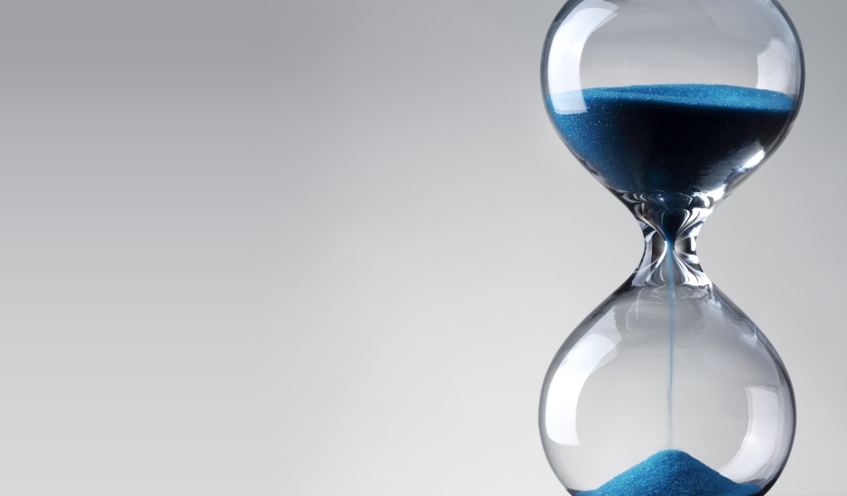 Time passing. Blue hourglass.