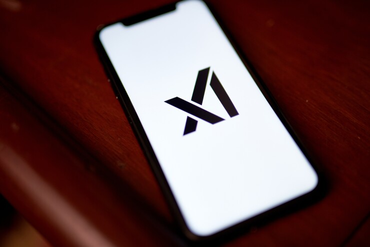 The xAI logo on a mobile phone