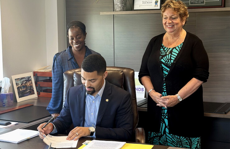 Connecticut State Treasurer Erick Russell signs Baby Bond trust documents