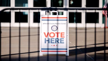 A "Vote Here" sign outside a polling location for the 2020 Presidential election in Louisville, Kentucky, U.S., on Tuesday, Nov. 3, 2020. American voters, at least those who've not yet cast ballots, go to the polls Tuesday to choose between President Donald Trump and Democratic nominee Joe Biden and cast votes in U.S. House and Senate races and state and local elections. Photographer: Scotty Perry/Bloomberg