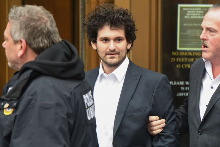 Sam Bankman-Fried, co-founder of FTX Cryptocurrency Derivatives Exchange, departs from court in New York, US, on Thursday, Dec. 22, 2022. Bankman-Fried was released on a $250 million bail package after making his first US court appearance to face fraud charges over the collapse of FTX, the cryptocurrency exchange he co-founded.