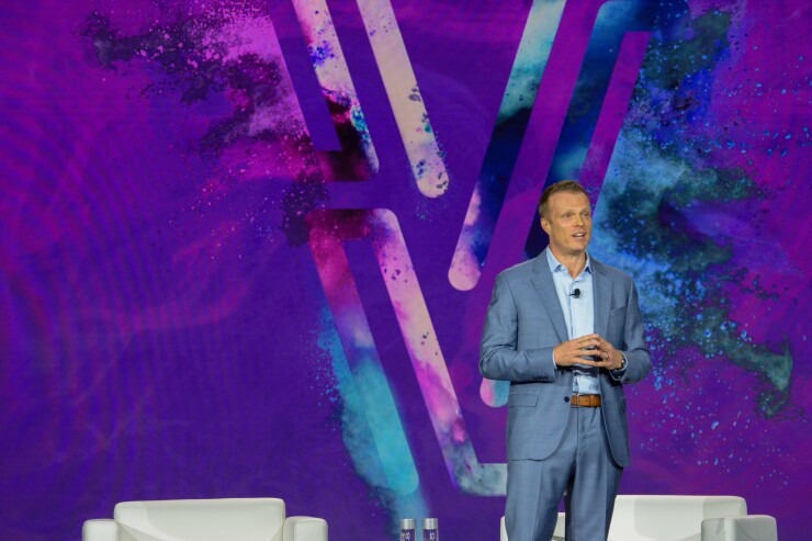 Scott Brown, group president of financial and marketing services for Experian North America, speaks at Experian Vision 2025 conference.