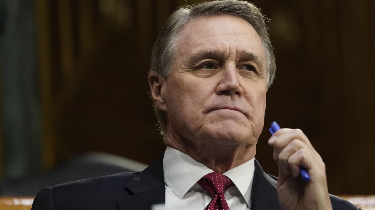 Sen. David Perdue, R-Ga., listens during a Senate Banking, Housing and Urban Affairs Committee hearing in Washington on Sept 24, 2020.