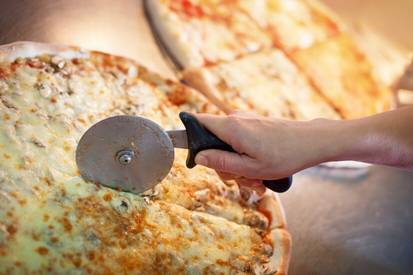 Cutting a piece or slice of pizza