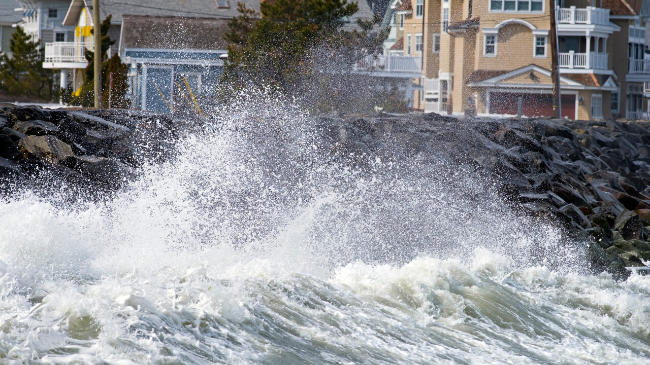 Coastal homes, waves crashing