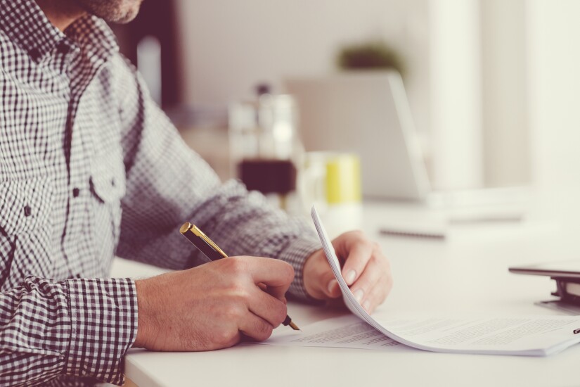 6-man-signing-documents.jpg