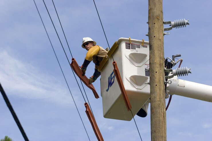 A lineman working for the utility JEA in Jacksonville, Florida.