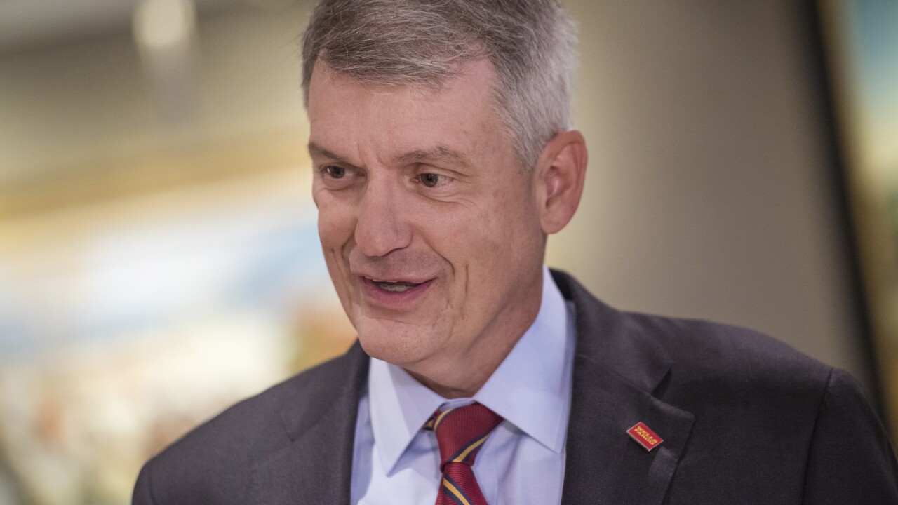 Tim Sloan, CEO of Wells Fargo, speaks with a reporter before a Bloomberg Television interview in San Francisco, May 23, 2017