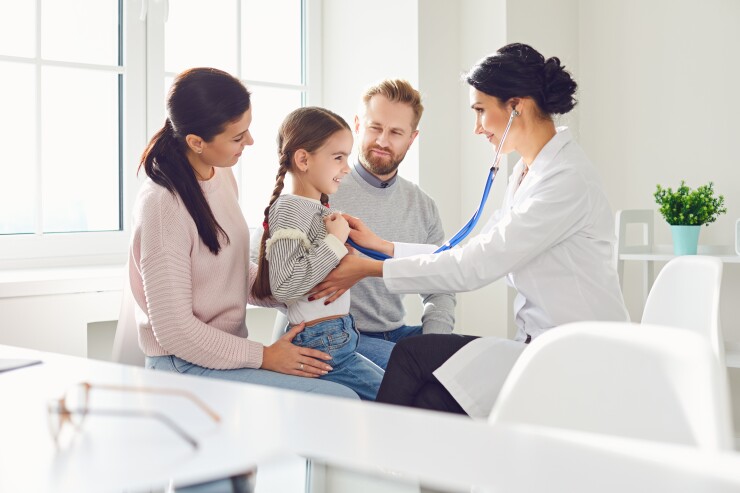 Family with small child at doctor's office