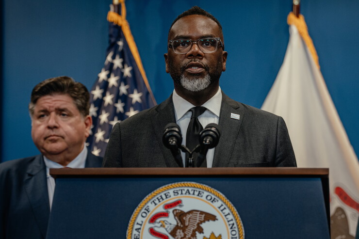 Chicago Mayor Brandon Johnson speaks at lectern