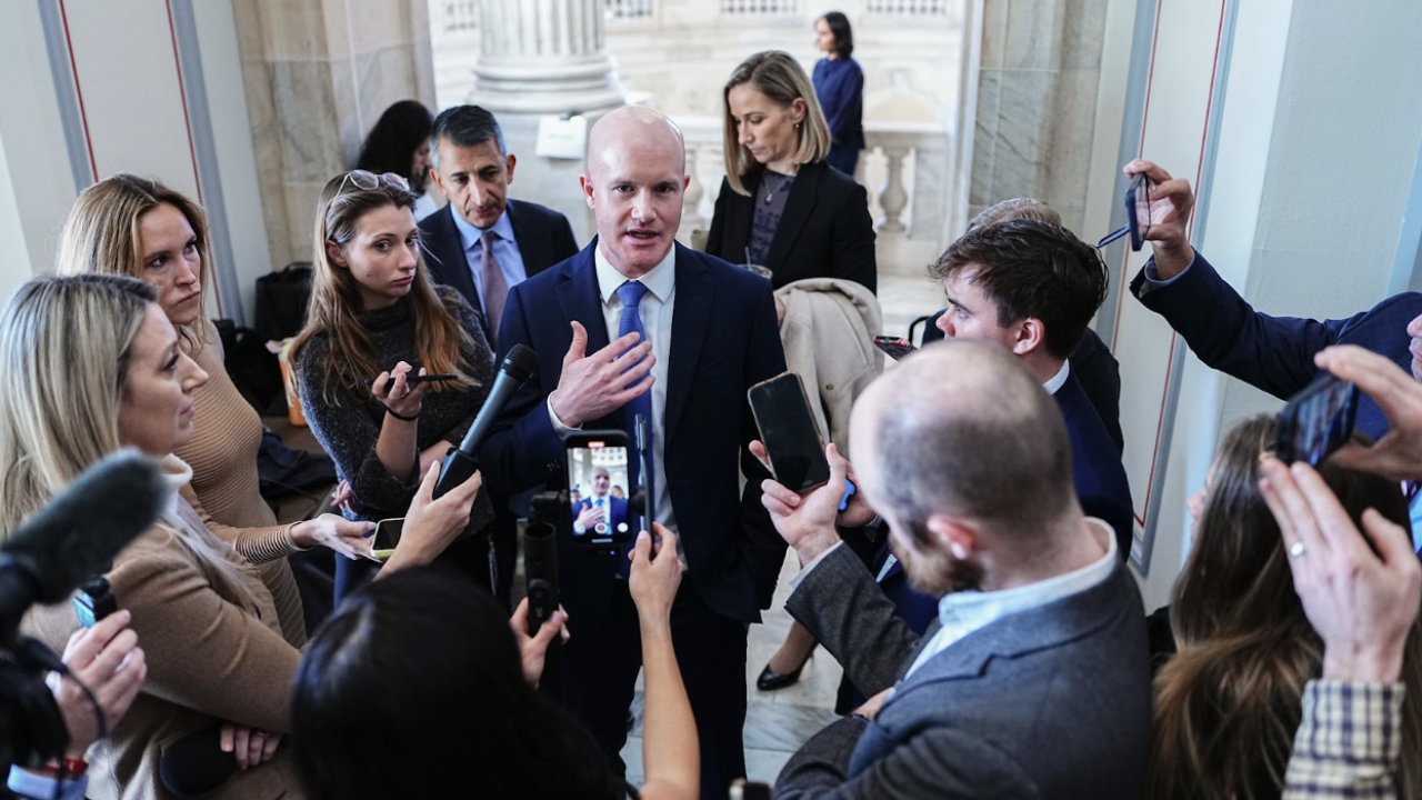 Coinbase CEO Brian Armstrong talking to reporters on Capitol Hill.