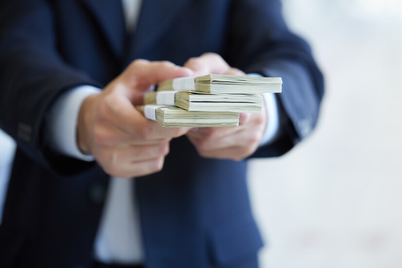 money-in-hands-85865405-adobe.jpeg